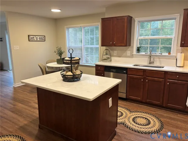 a kitchen with a sink appliances and a window