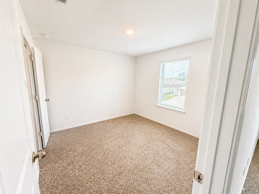 5218 Mossdale Blf Lane Spring, TX 77373 - Photo 12 of 14 an empty room with windows