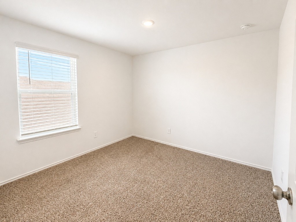 5218 Mossdale Blf Lane Spring, TX 77373 - Photo 13 of 14 an empty room with a window