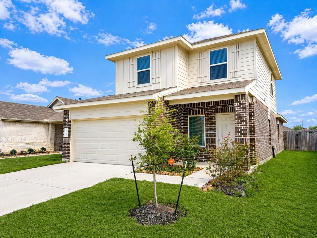 5218 Mossdale Blf Lane Spring, TX 77373 - Photo 2 of 14 a front view of a house with a yard and garage