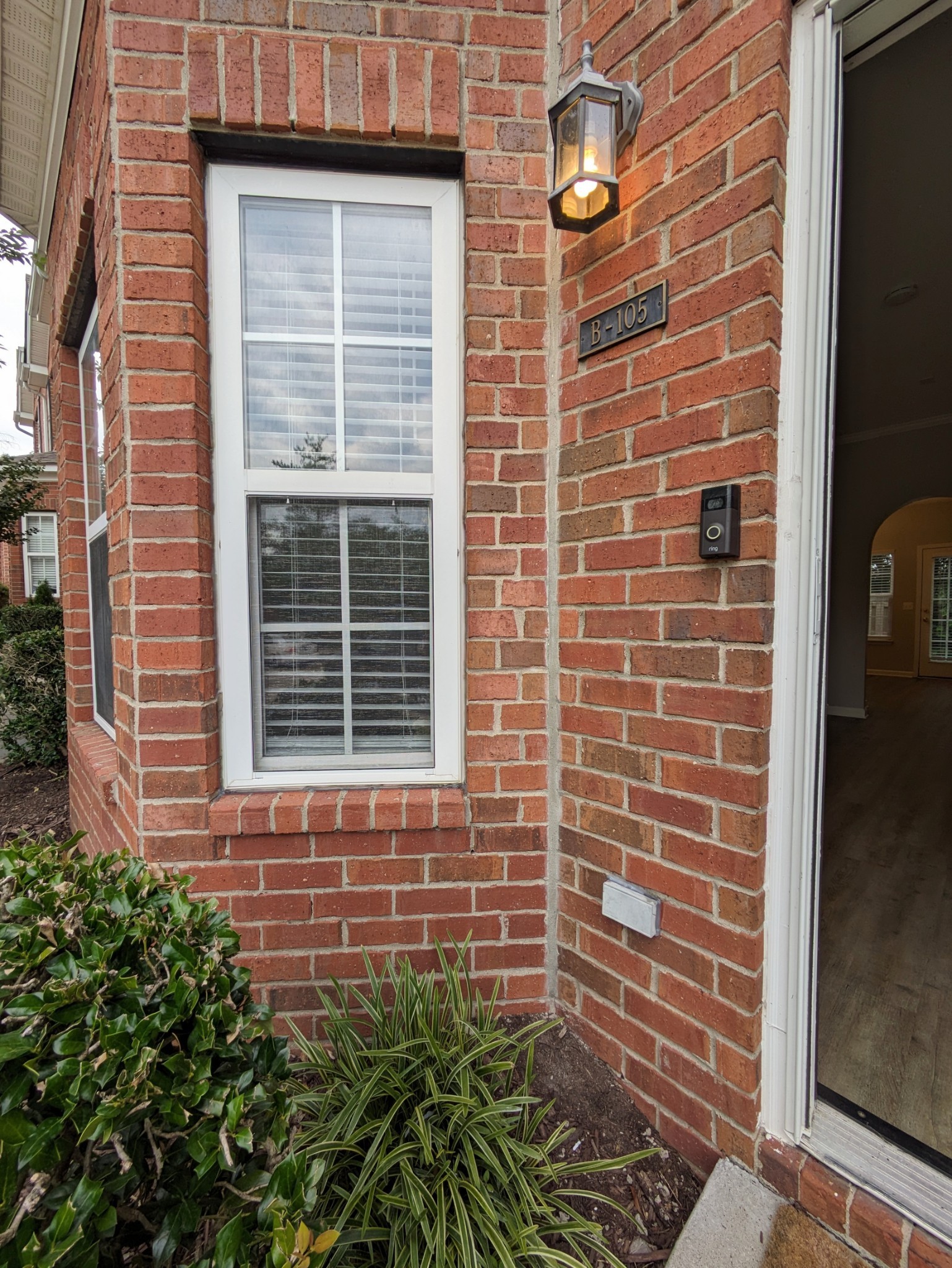 1101 Downs Boulevard, Unit B105 Franklin, TN 37064 - Photo 2 of 44 a view of a brick house with a large windows
