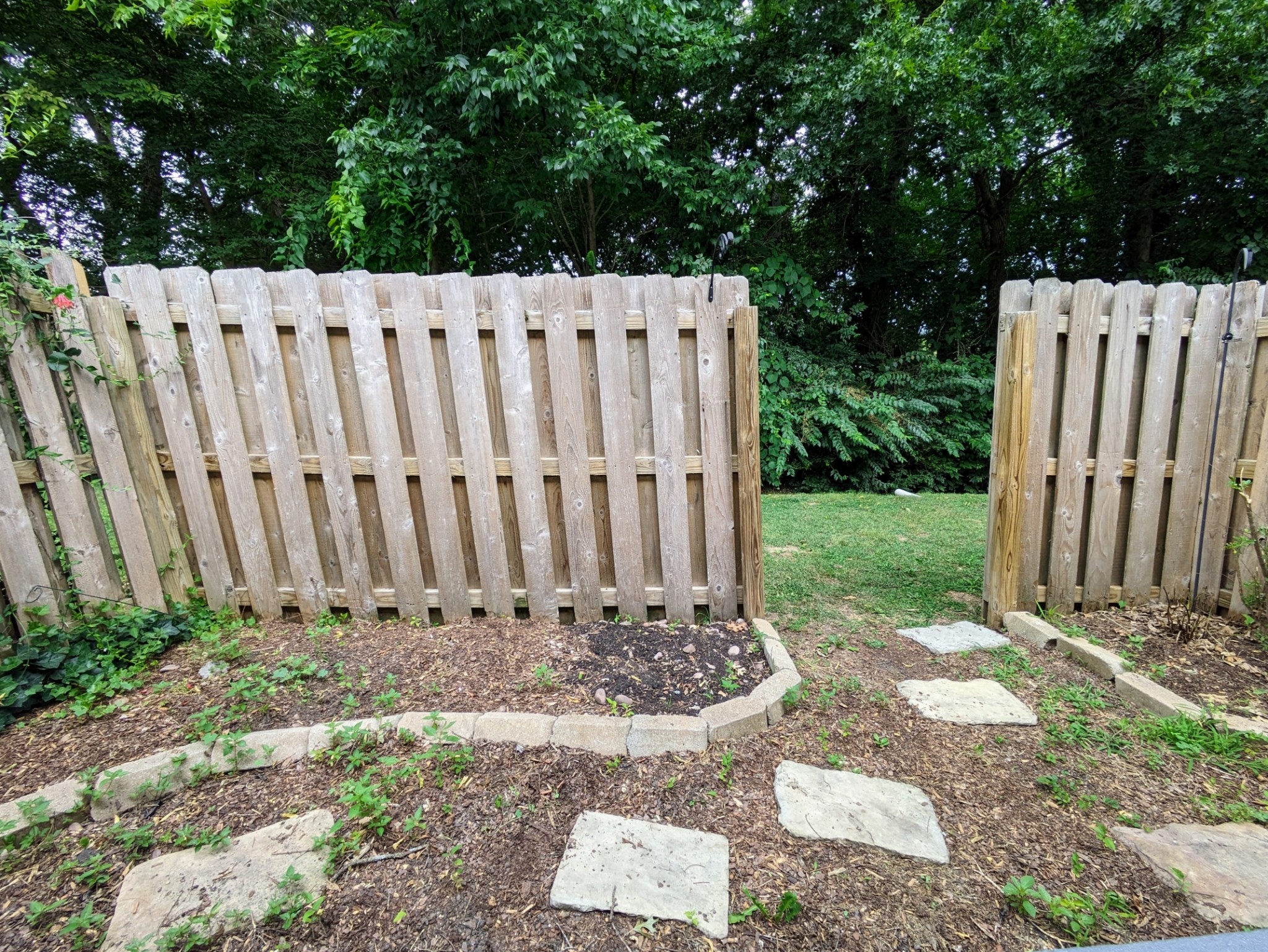 1101 Downs Boulevard, Unit B105 Franklin, TN 37064 - Photo 24 of 44 a view of a small yard with wooden fence