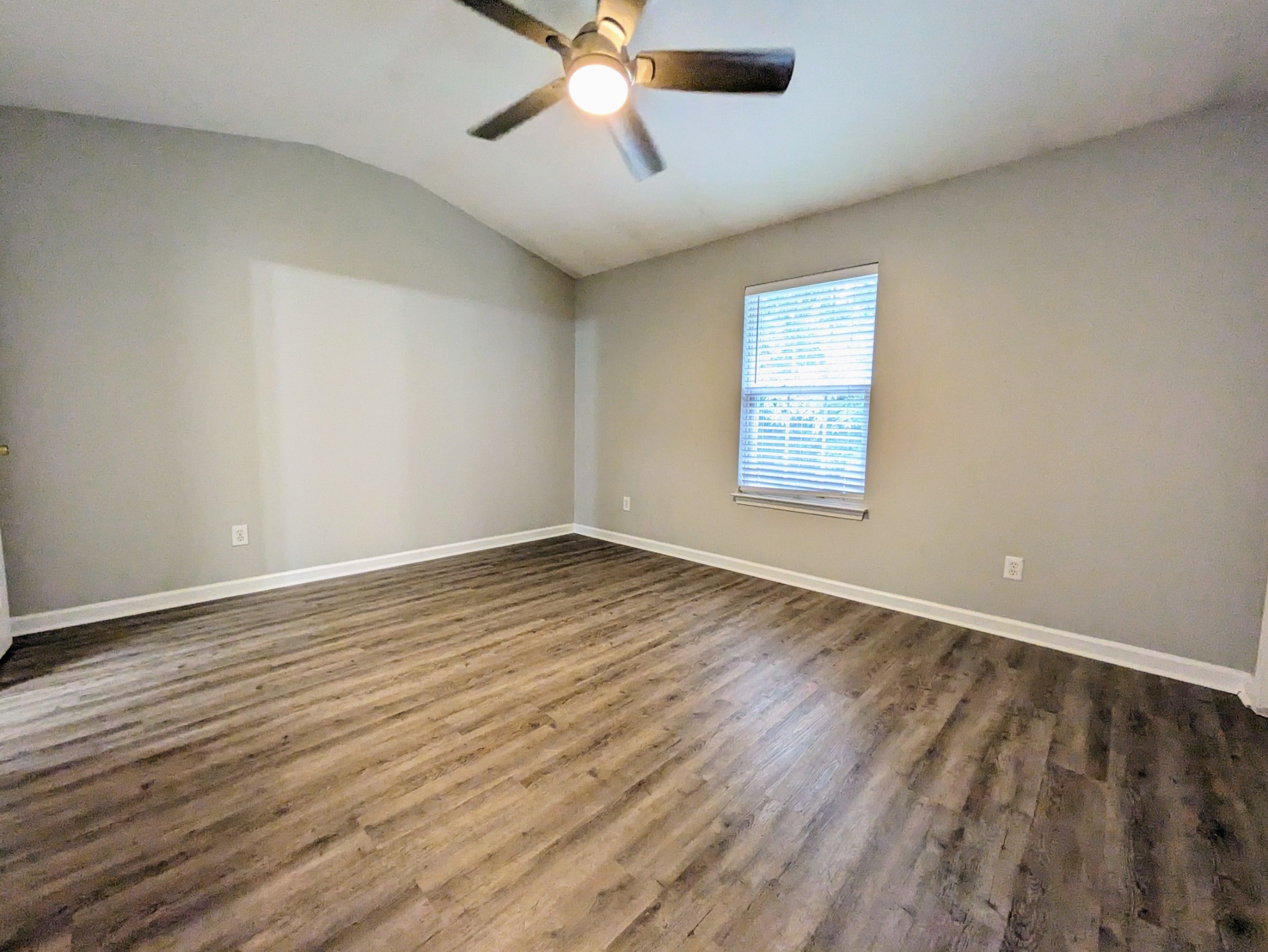 1101 Downs Boulevard, Unit B105 Franklin, TN 37064 - Photo 35 of 44 wooden floor in an empty room with a window