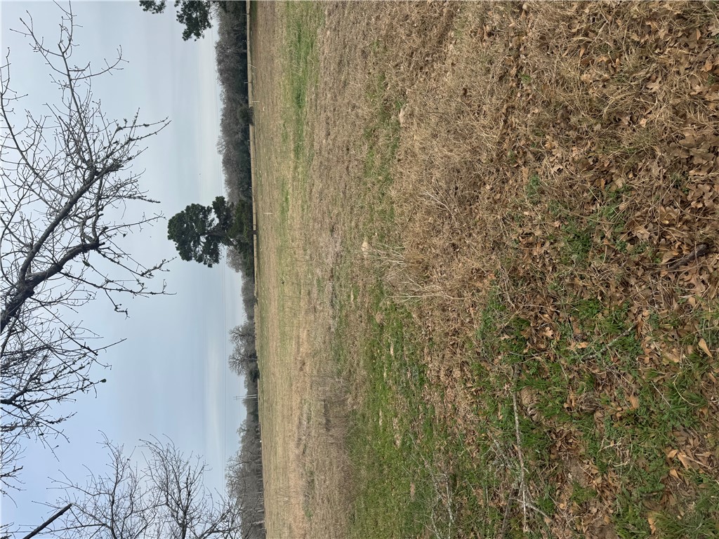 Tbd Signal Street Somerville, TX 77879 - Photo 2 of 6 a view of a lake with a house in background
