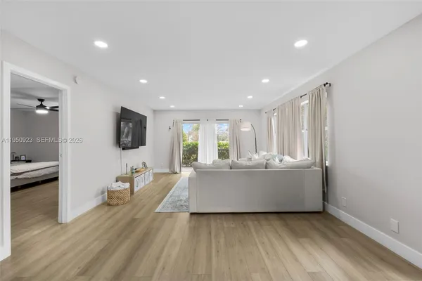 a living room with furniture and a flat screen tv