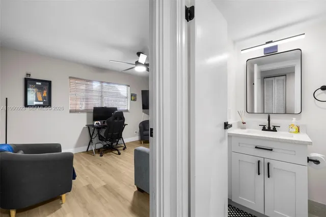 a view of a livingroom with workspace and a couch