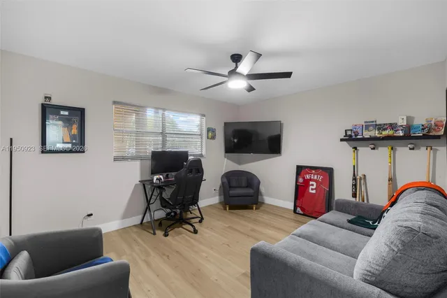a view of a livingroom with workspace and a couch