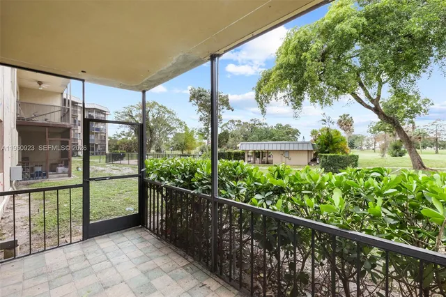 a view of a glass door with a balcony
