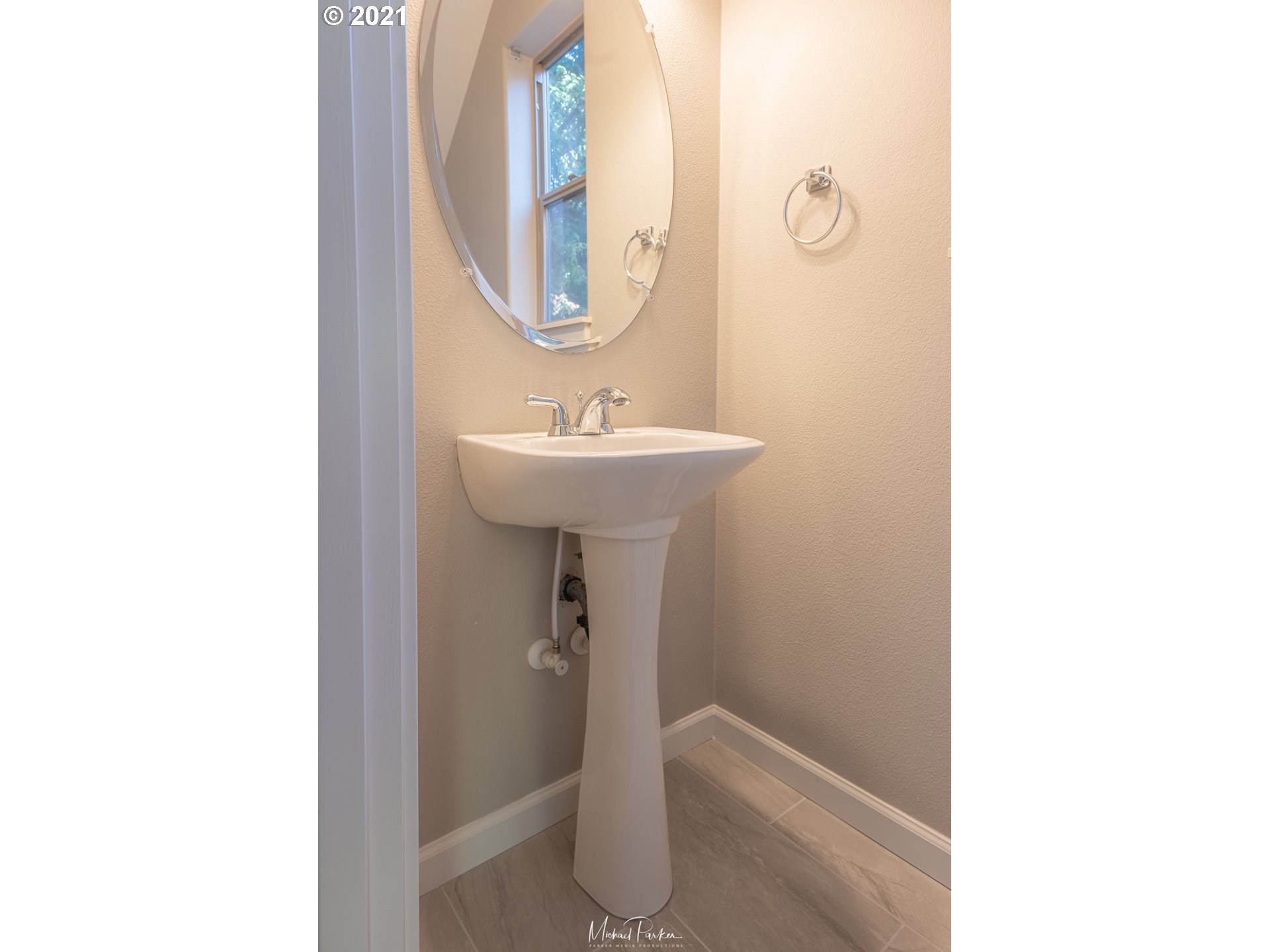 19947 Southwest Jette Lane Aloha, OR 97003 - Photo 13 of 26 a bathroom with a sink and a mirror
