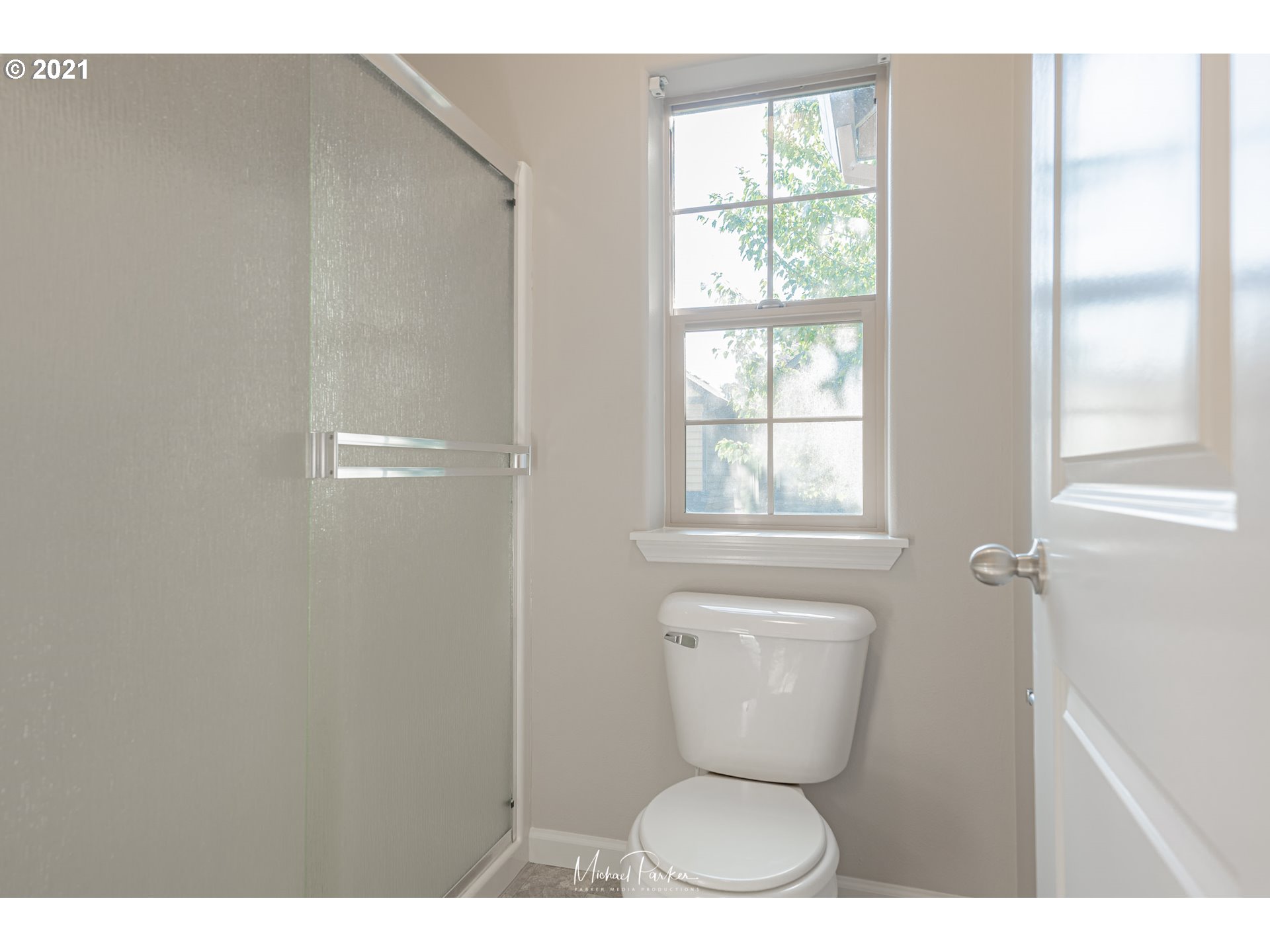 19947 Southwest Jette Lane Aloha, OR 97003 - Photo 19 of 26 a bathroom with a toilet next to a window