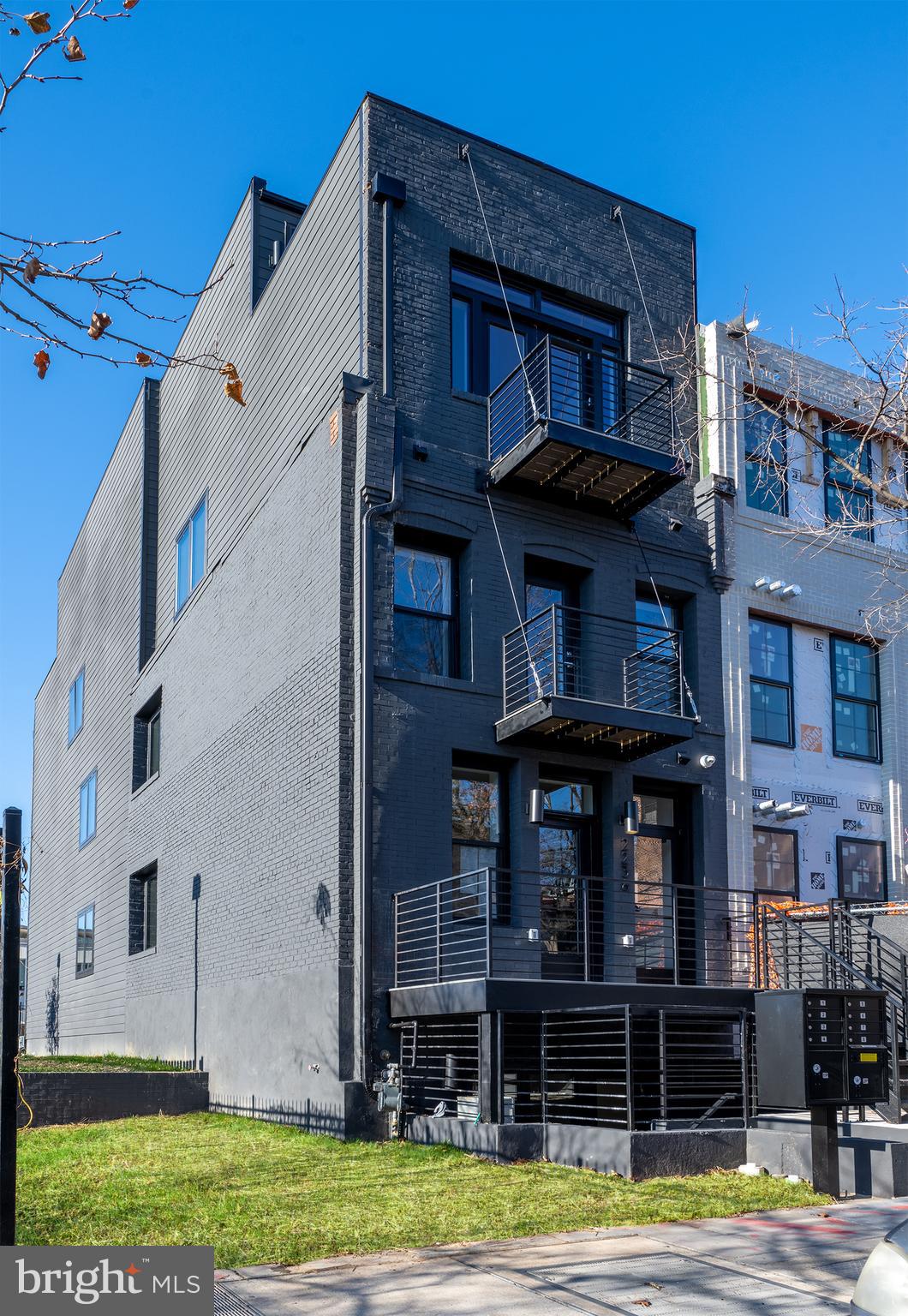 2238 Ontario Road Northwest, Unit 8 Washington, DC 20009 - Photo 1 of 19 a view of a building with a yard