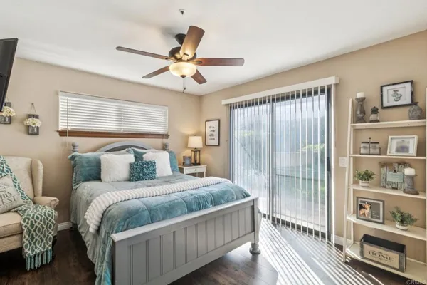 a bedroom with a large bed and a window