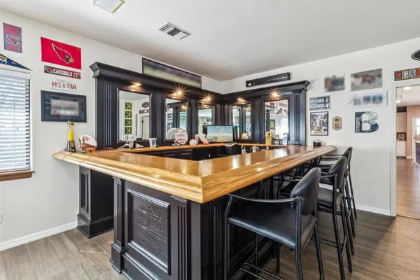 a room with furniture pool table and windows
