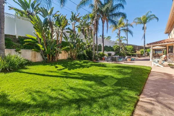 a view of a backyard with a patio