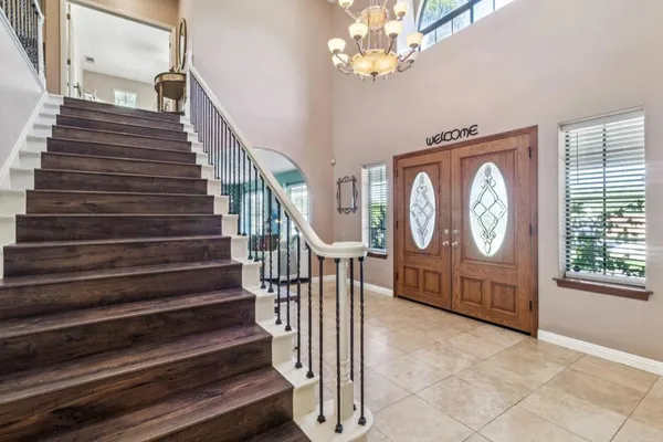 a view of entryway with wooden floor and window