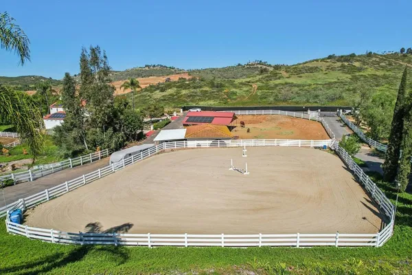 an aerial view of residential house and outdoor space