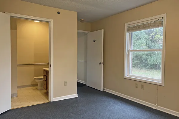 a view of a bathroom with a shower and a toilet