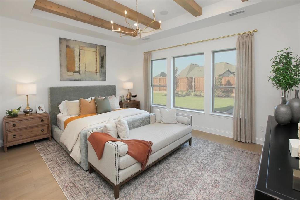 225 Bee Balm Road McKinney, TX 75071 - Photo 18 of 30 a spacious bedroom with a bed and a large window