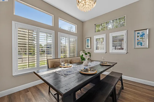 a dining room with furniture and window