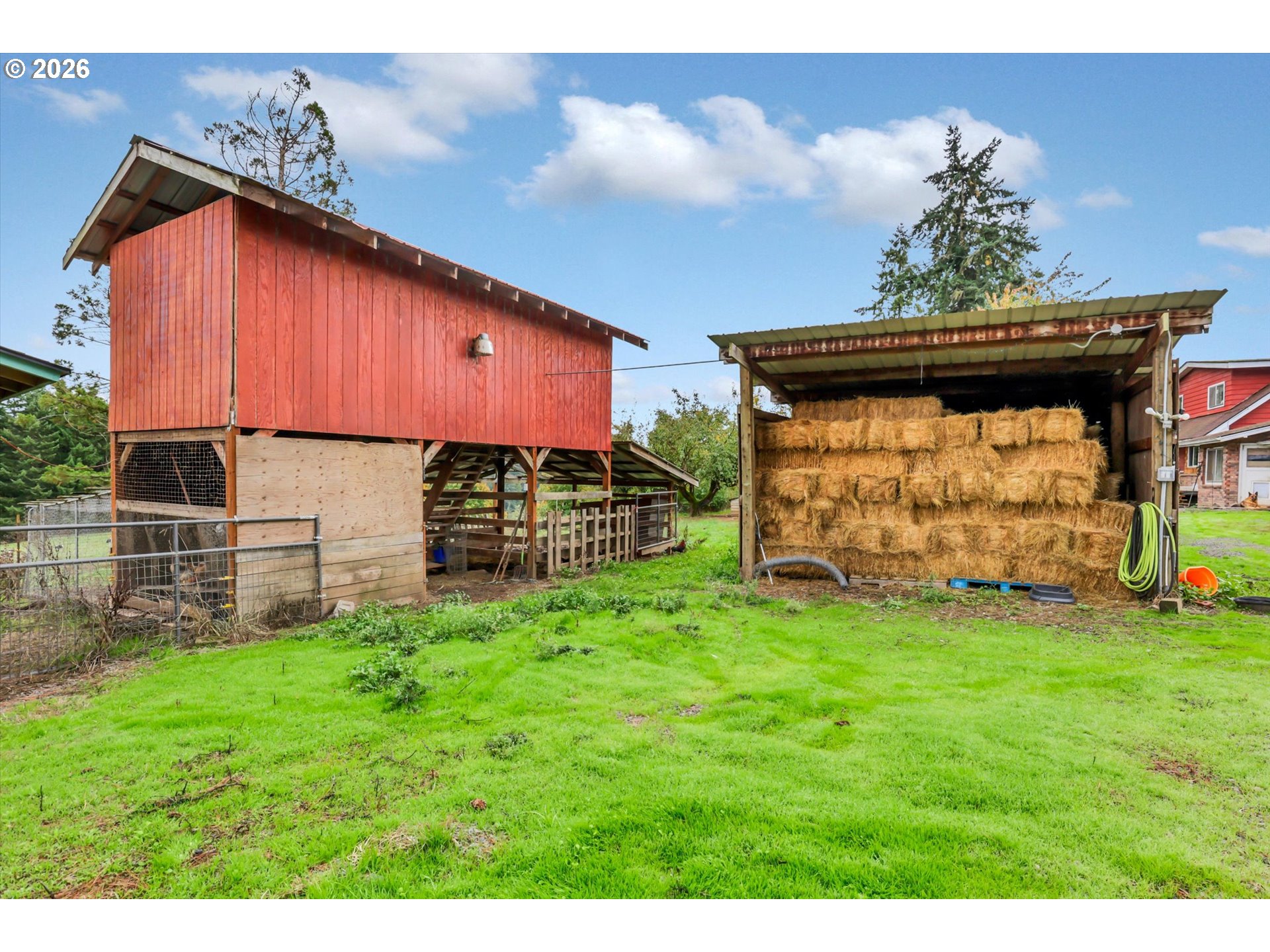 68763 Wasser Road Rainier, OR 97048 - Photo 15 of 34 a view of a backyard with potted plants and a chair