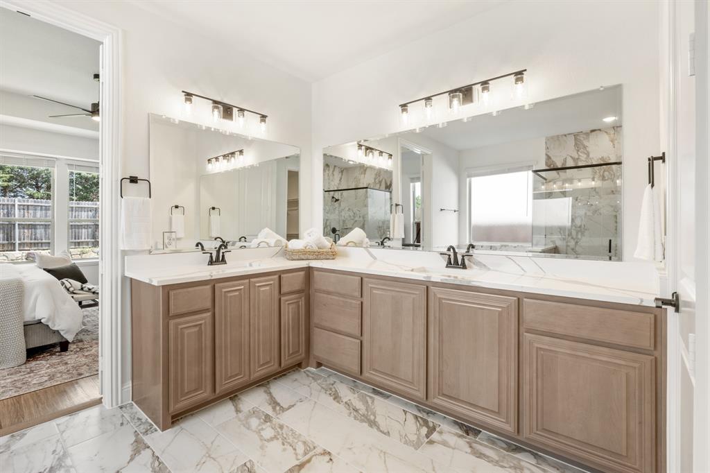 3433 Nightingale Lane Midlothian, TX 76065 - Photo 21 of 40 a spacious bathroom with a double vanity sink mirror and