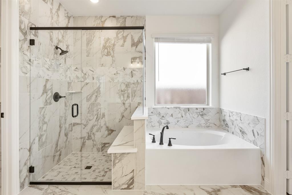 3433 Nightingale Lane Midlothian, TX 76065 - Photo 22 of 40 a white bath tub sitting next to a shower