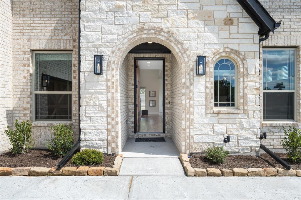 3433 Nightingale Lane Midlothian, TX 76065 - Photo 3 of 40 a view of a brick house with potted plants