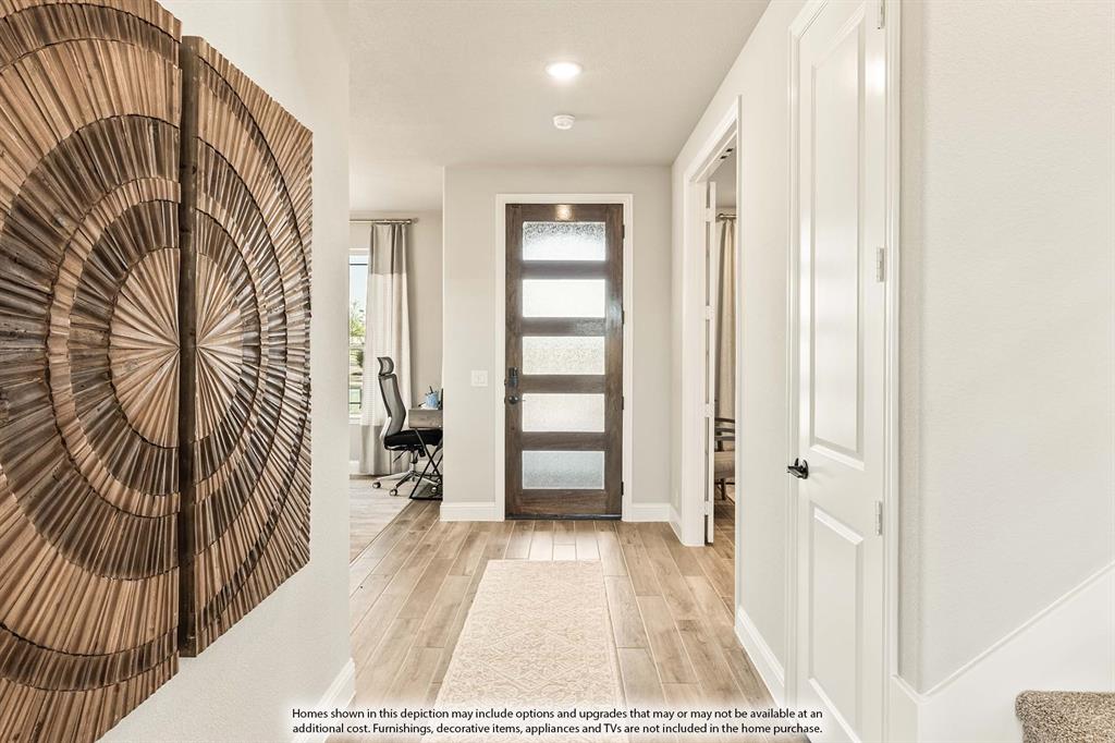 3433 Nightingale Lane Midlothian, TX 76065 - Photo 3 of 40 a view of a hallway with wooden floor and a bathroom