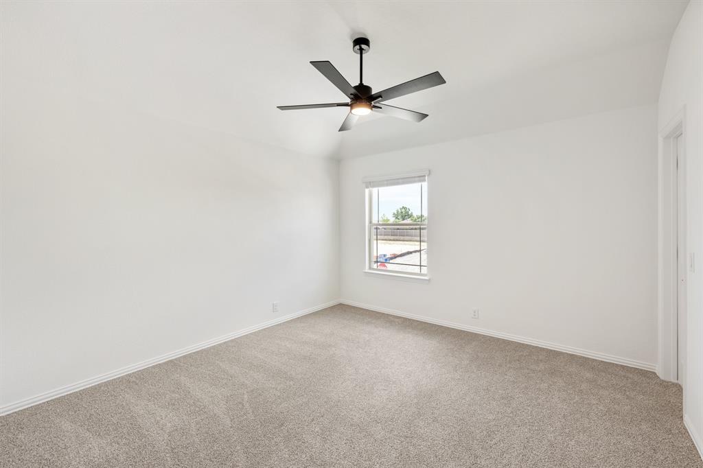 3433 Nightingale Lane Midlothian, TX 76065 - Photo 34 of 40 an empty room with a window and a fan