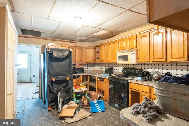 a kitchen with stainless steel appliances granite countertop a stove and a refrigerator