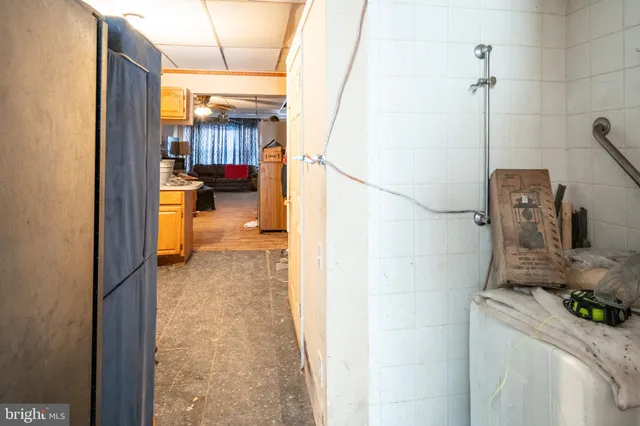 a bathroom with a sink a mirror and shower