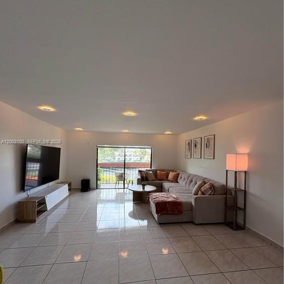 8650 Southwest 149th Avenue, Unit 310 Miami, FL 33193 - Photo 1 of 16 a living room with furniture and a flat screen tv