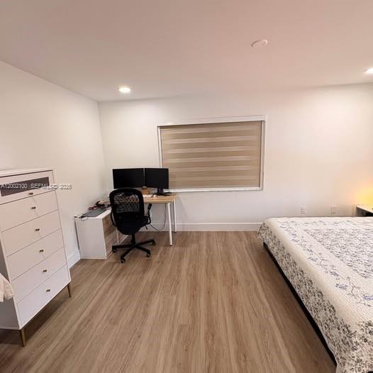 8650 Southwest 149th Avenue, Unit 310 Miami, FL 33193 - Photo 11 of 16 a bedroom with a bed and a chair