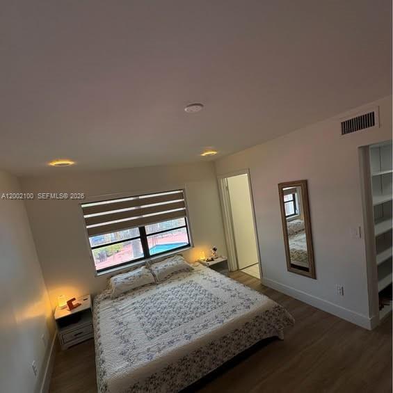 8650 Southwest 149th Avenue, Unit 310 Miami, FL 33193 - Photo 14 of 16 a living room with a bed furniture and painting on the wall