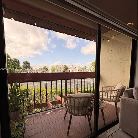 8650 Southwest 149th Avenue, Unit 310 Miami, FL 33193 - Photo 16 of 16 a view of a balcony with furniture