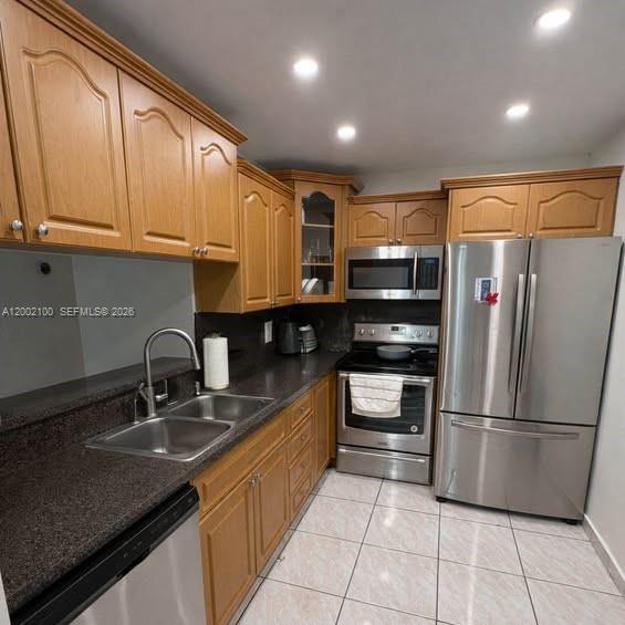 8650 Southwest 149th Avenue, Unit 310 Miami, FL 33193 - Photo 5 of 16 a kitchen with stainless steel appliances granite countertop a refrigerator and a sink