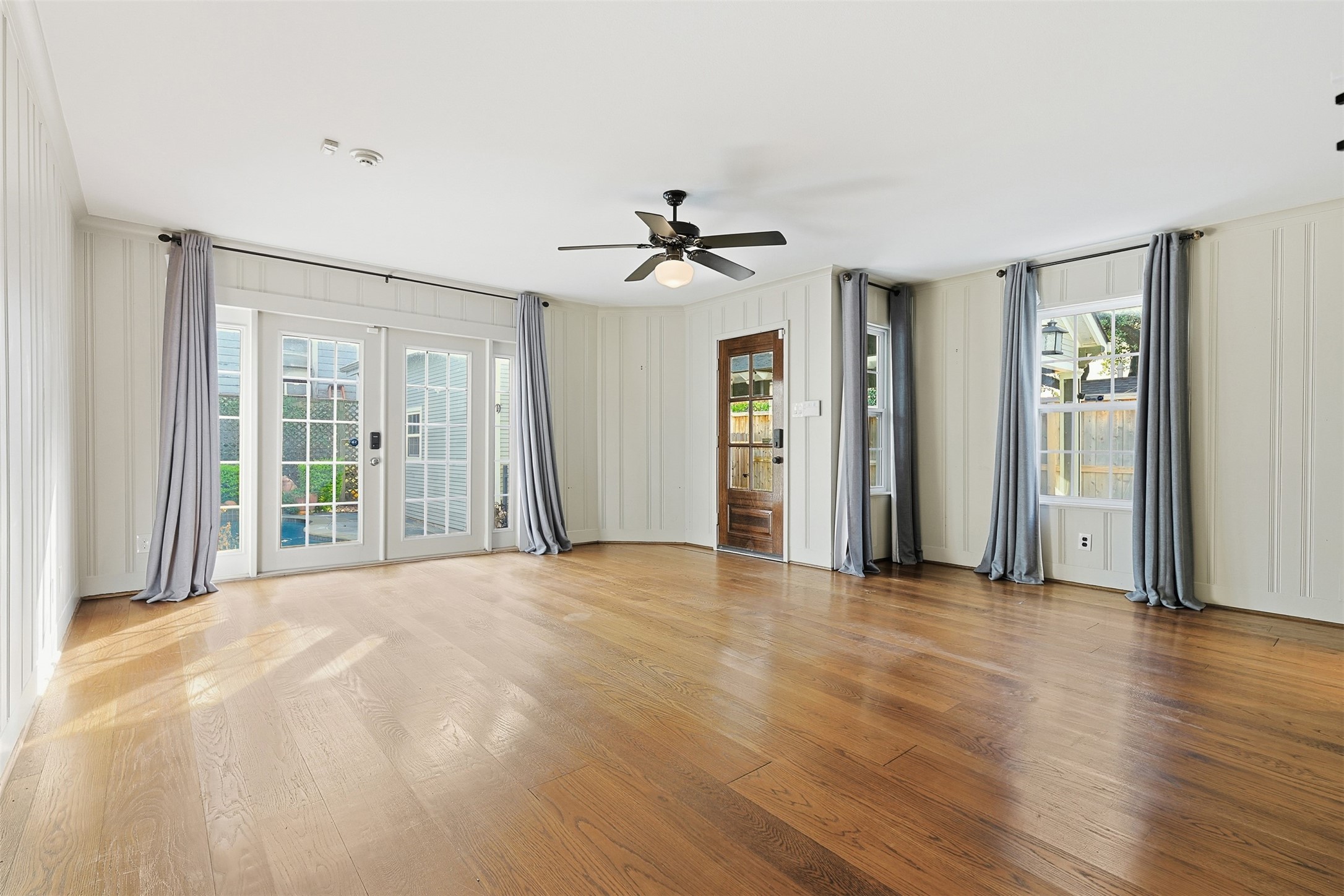 1311 Peden Street Houston, TX 77006 - Photo 11 of 21 a view of a room with wooden floor and a ceiling fan