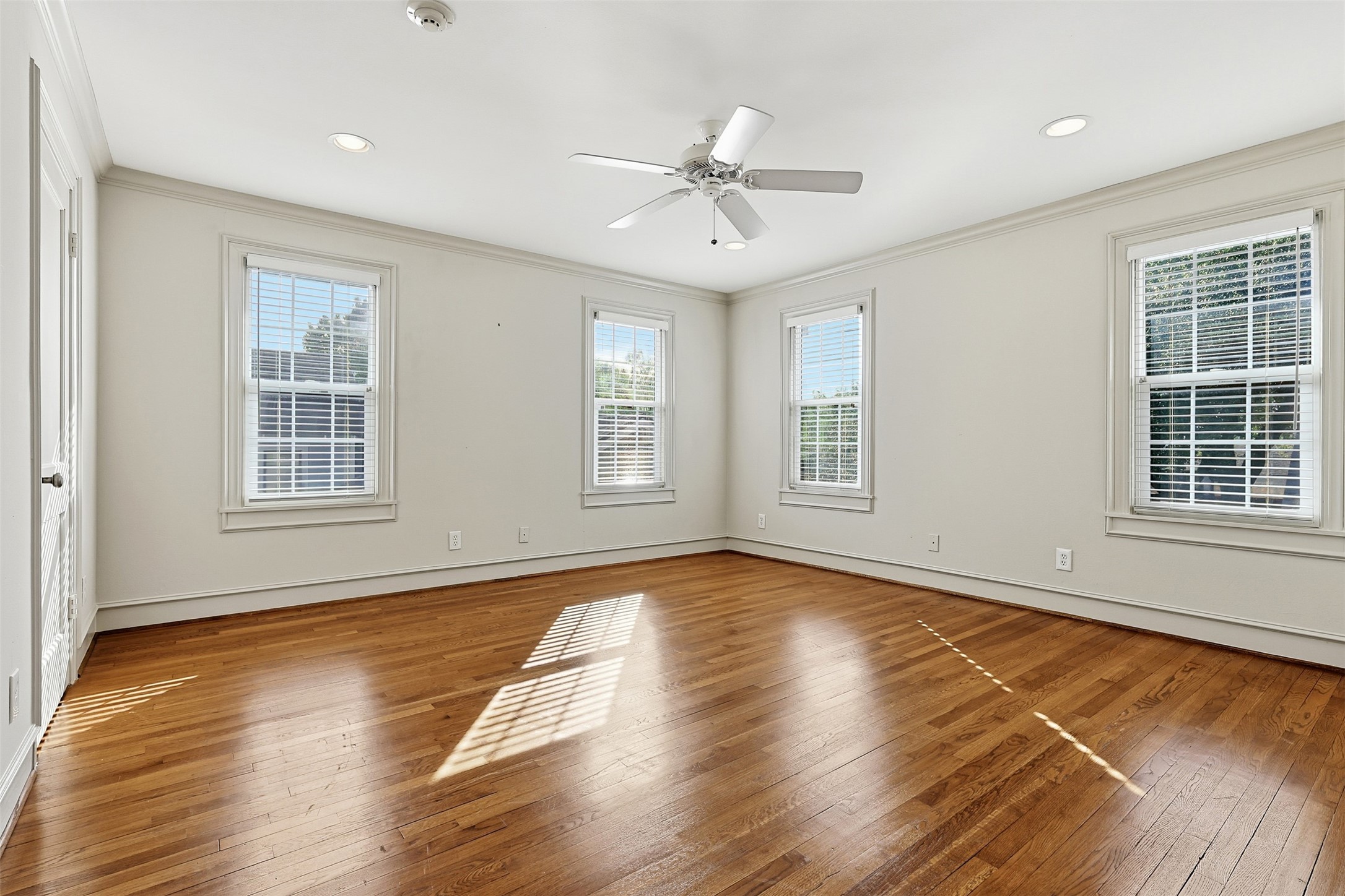 1311 Peden Street Houston, TX 77006 - Photo 15 of 21 a view of an empty room with wooden floor and a window