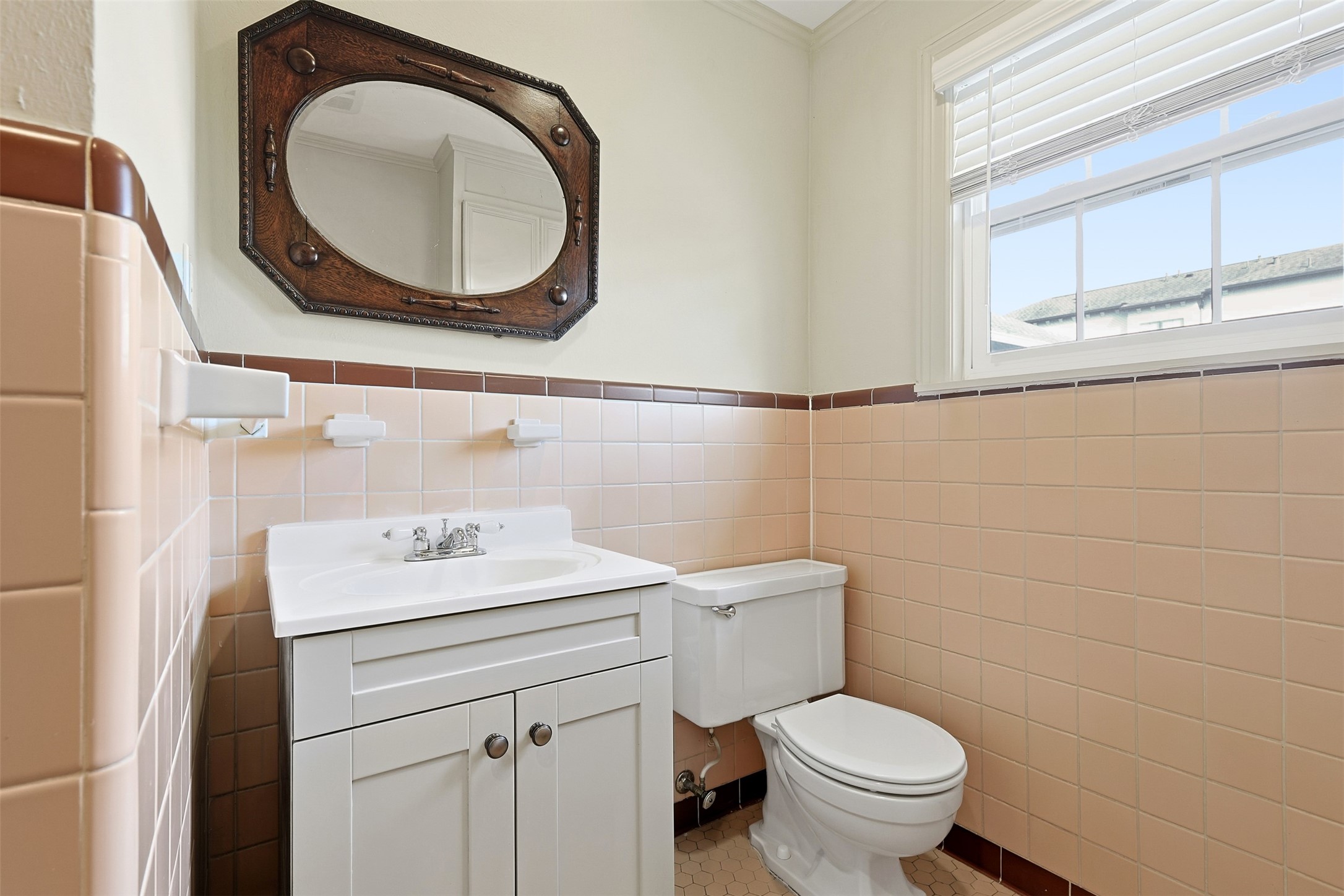 1311 Peden Street Houston, TX 77006 - Photo 16 of 21 a bathroom with a sink a toilet and a mirror