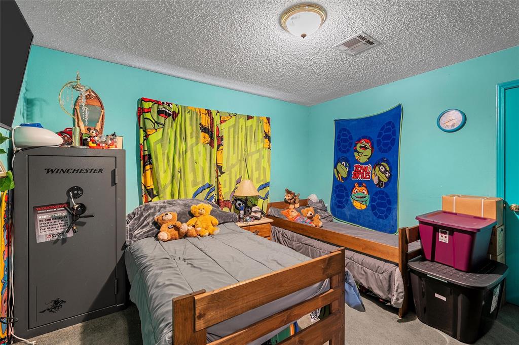 416 Capps Street Marlin, TX 76661 - Photo 14 of 25 a bed room with furniture and a window