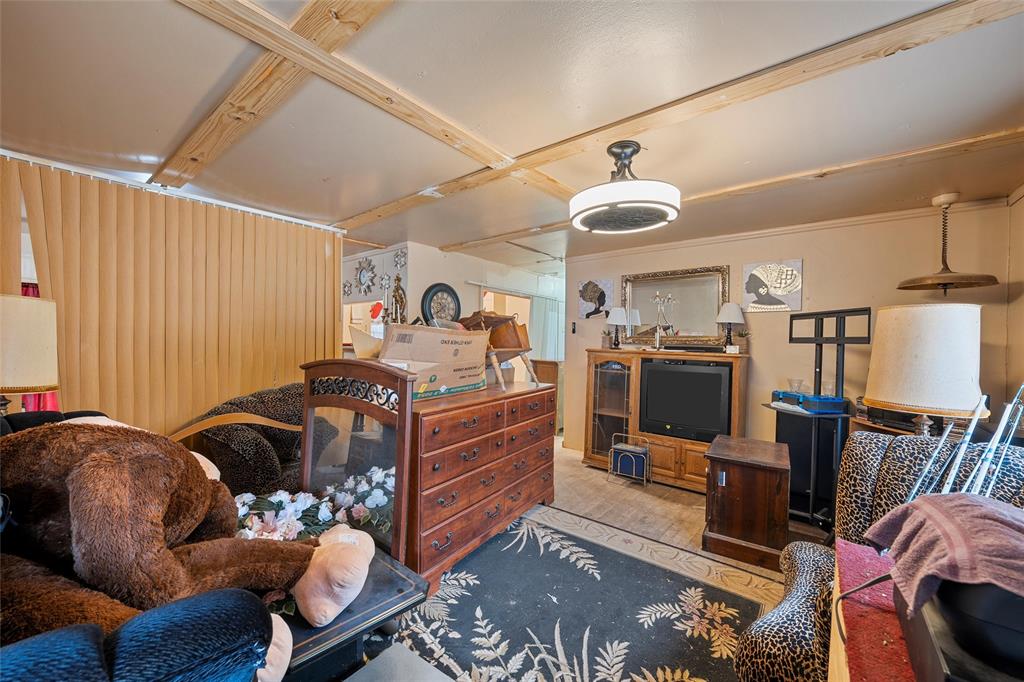 416 Capps Street Marlin, TX 76661 - Photo 19 of 25 a living room with furniture a air conditioner and a window