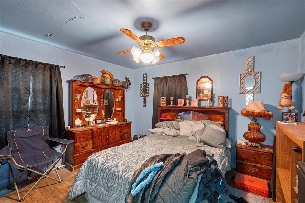 416 Capps Street Marlin, TX 76661 - Photo 22 of 25 a bedroom with a bed and wooden furniture