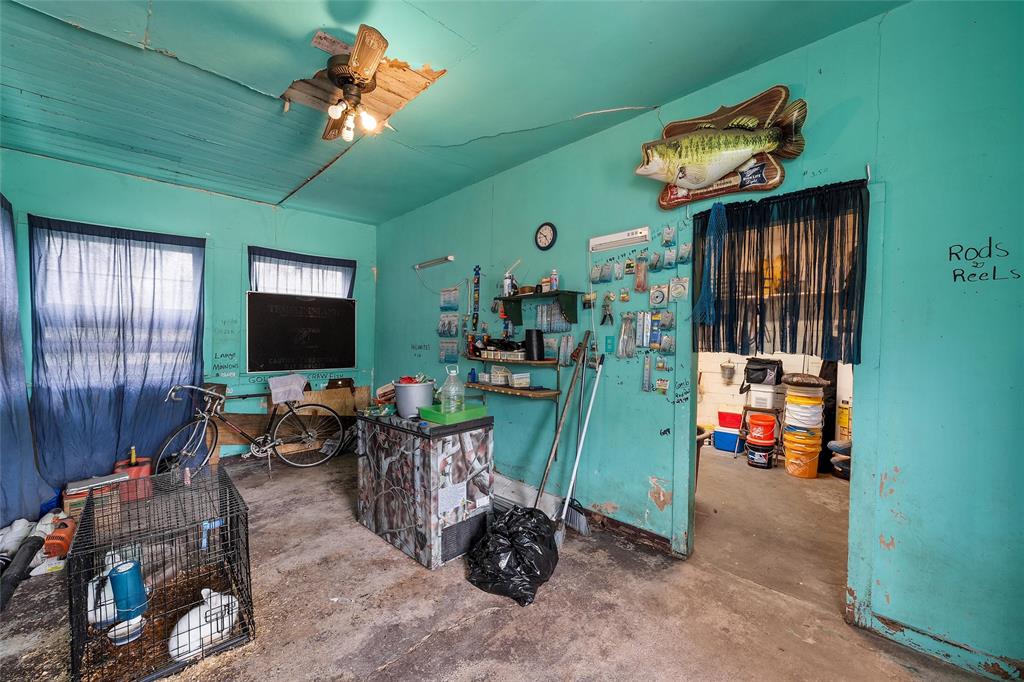 416 Capps Street Marlin, TX 76661 - Photo 25 of 25 a living room with furniture a flat screen tv and a chandelier