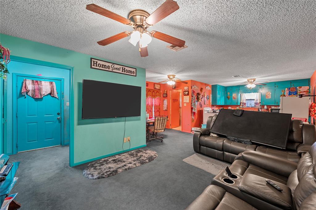416 Capps Street Marlin, TX 76661 - Photo 4 of 25 a living room with furniture and a flat screen tv