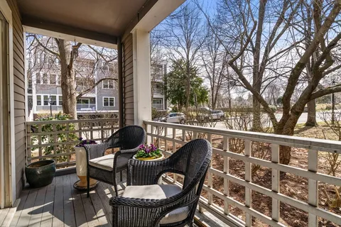 a view of a chairs and table in patio