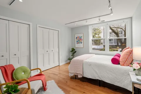 a bedroom with a bed and window