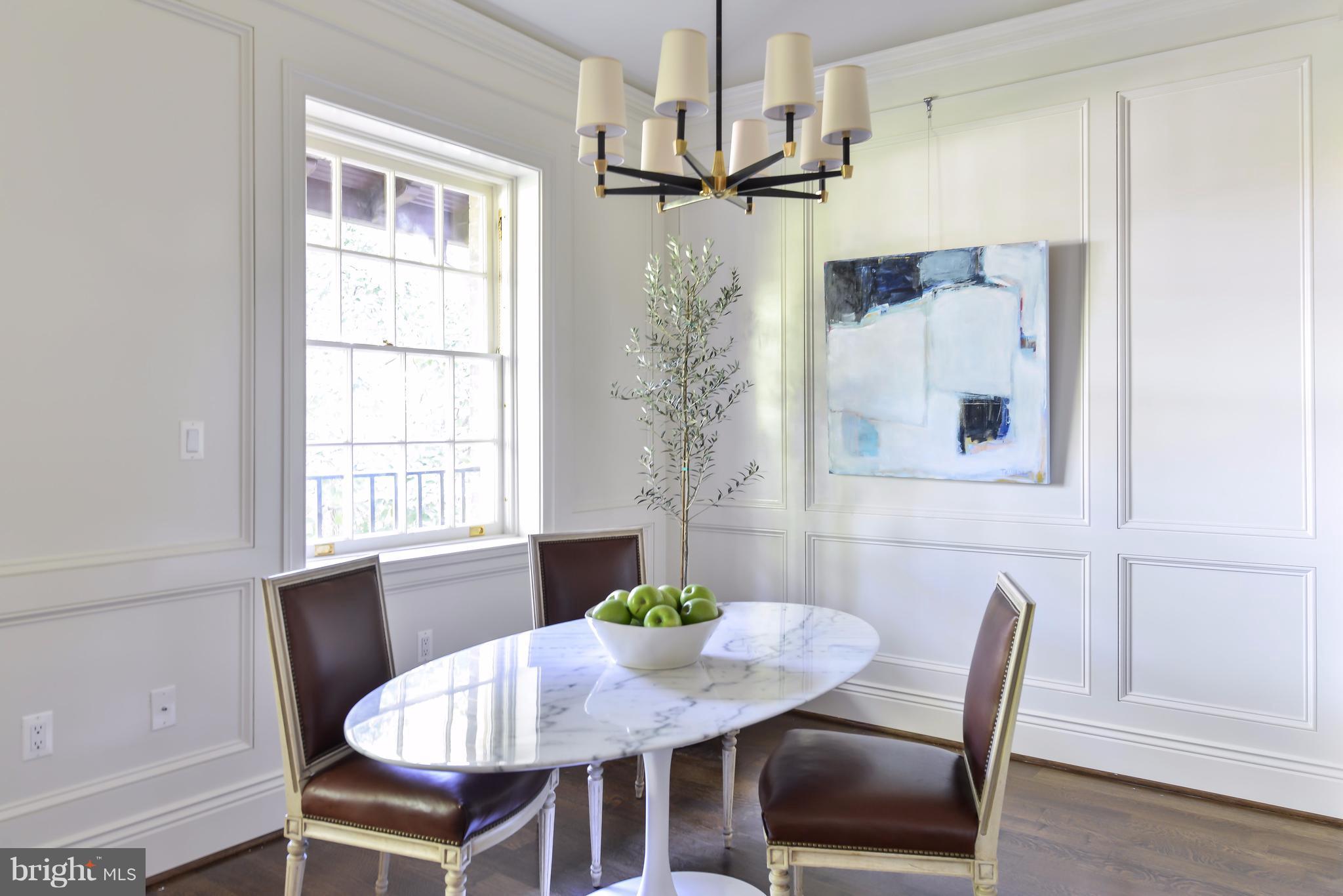 1848 Biltmore Street Northwest, Unit 4 Washington, DC 20009 - Photo 8 of 20 a view of a dining room with furniture window and wooden floor