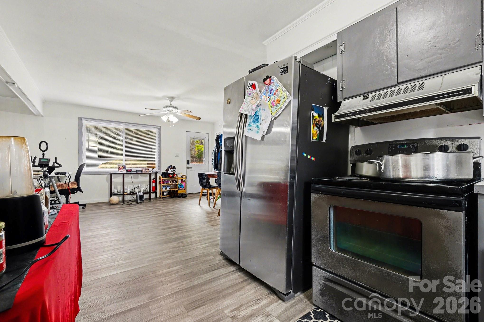 128 Paul Snipes Road Lancaster, SC 29720 - Photo 8 of 29 a kitchen with stainless steel appliances kitchen island granite countertop a stove and cabinets