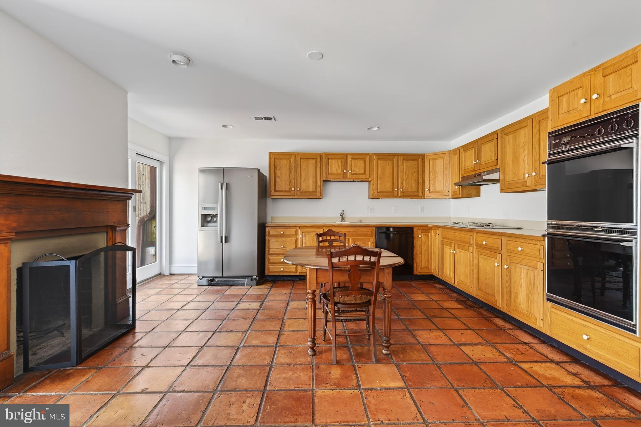 306 9th Street Southeast Washington, DC 20003 - Photo 15 of 50 a kitchen with stainless steel appliances a stove a sink and a refrigerator