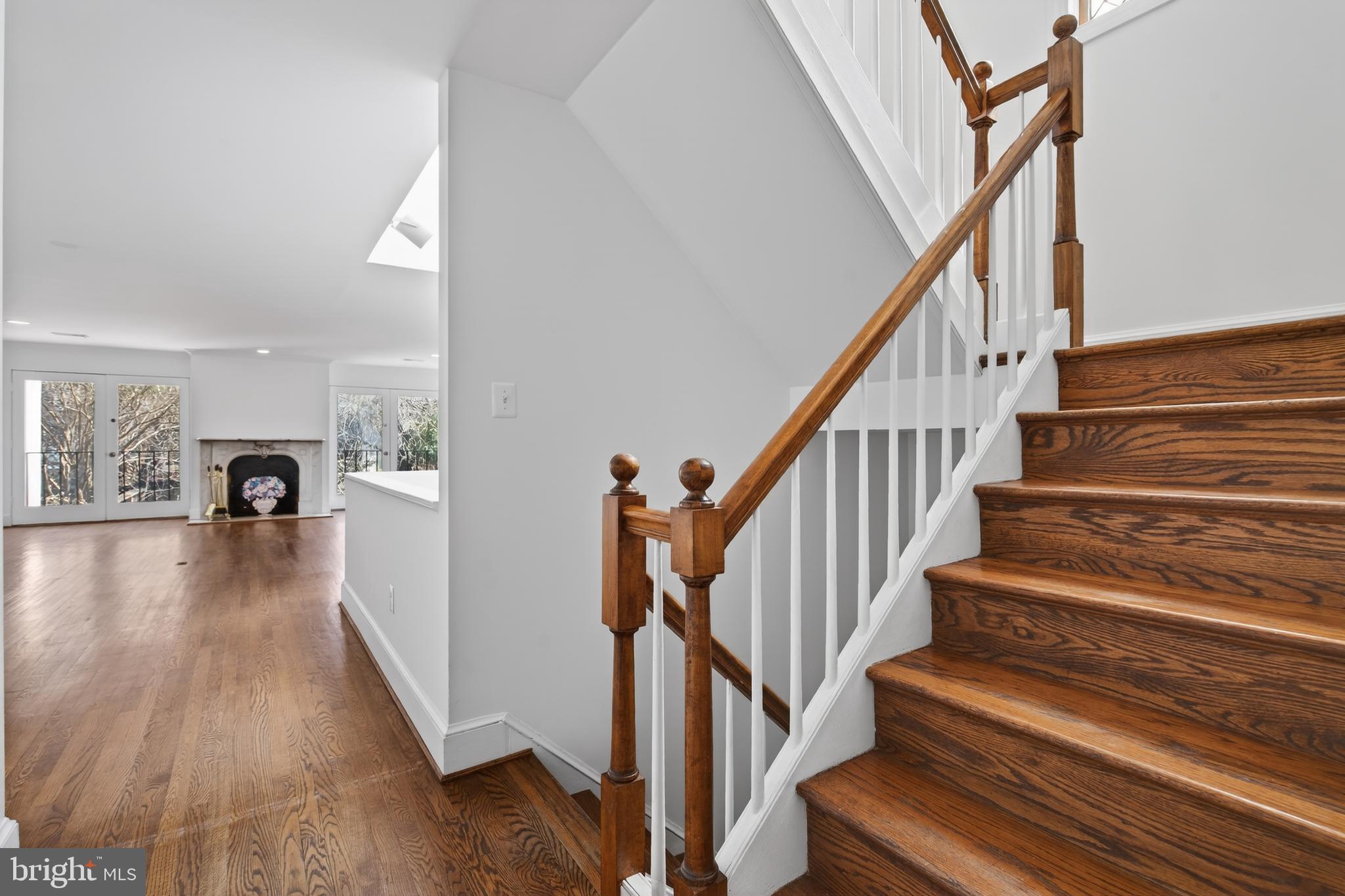 306 9th Street Southeast Washington, DC 20003 - Photo 21 of 50 a view of staircase with wooden floor and a rug